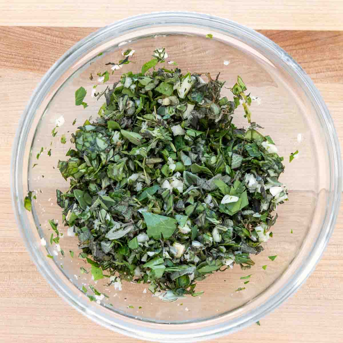 garlic herb seasoning blend in a glass bowl