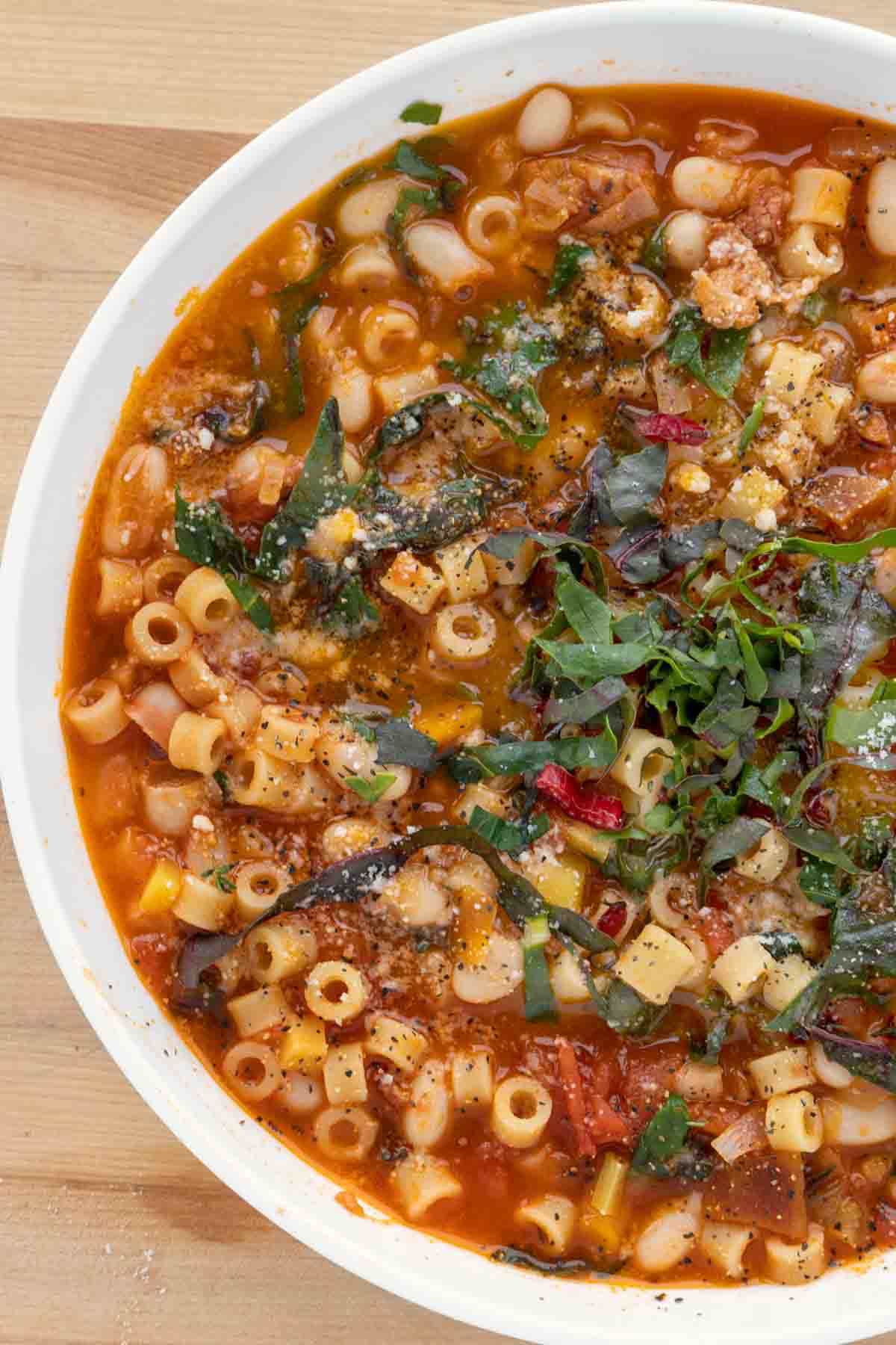 view of pasta fagioli in a white bowl