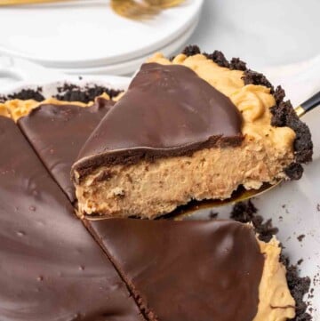 slice of peanut butter pie on a spatula being taken out of whole pie