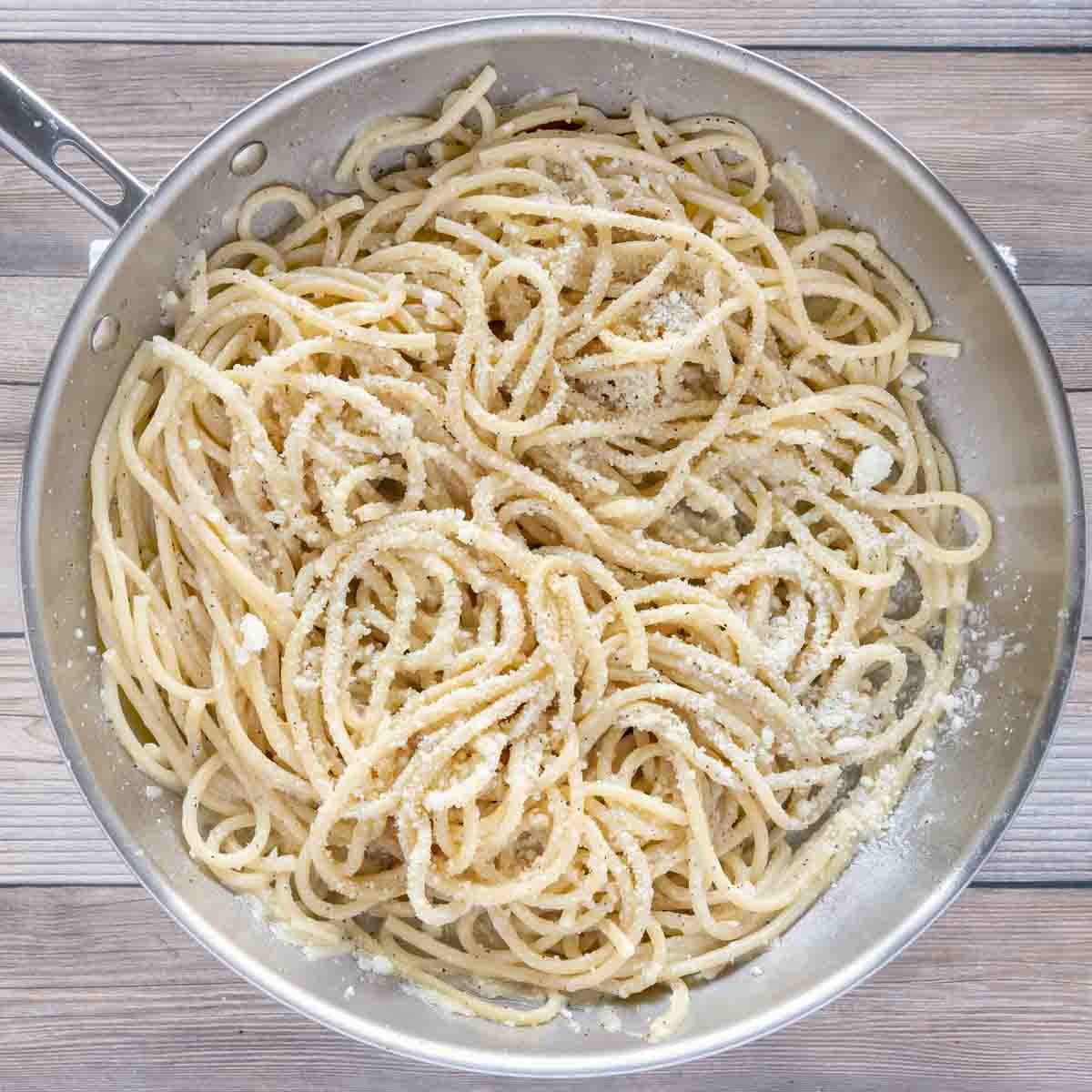 bucatini added to large skillet with butter and pepper mixture