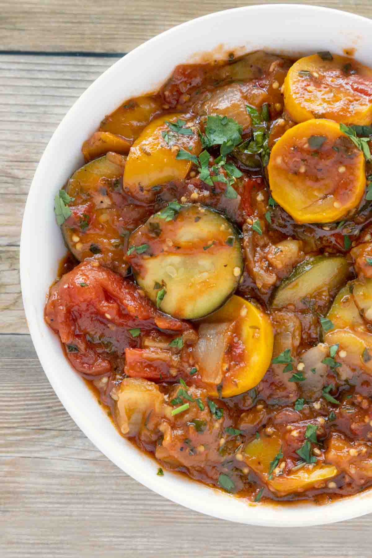 partial view of ratatouille in a white bowl