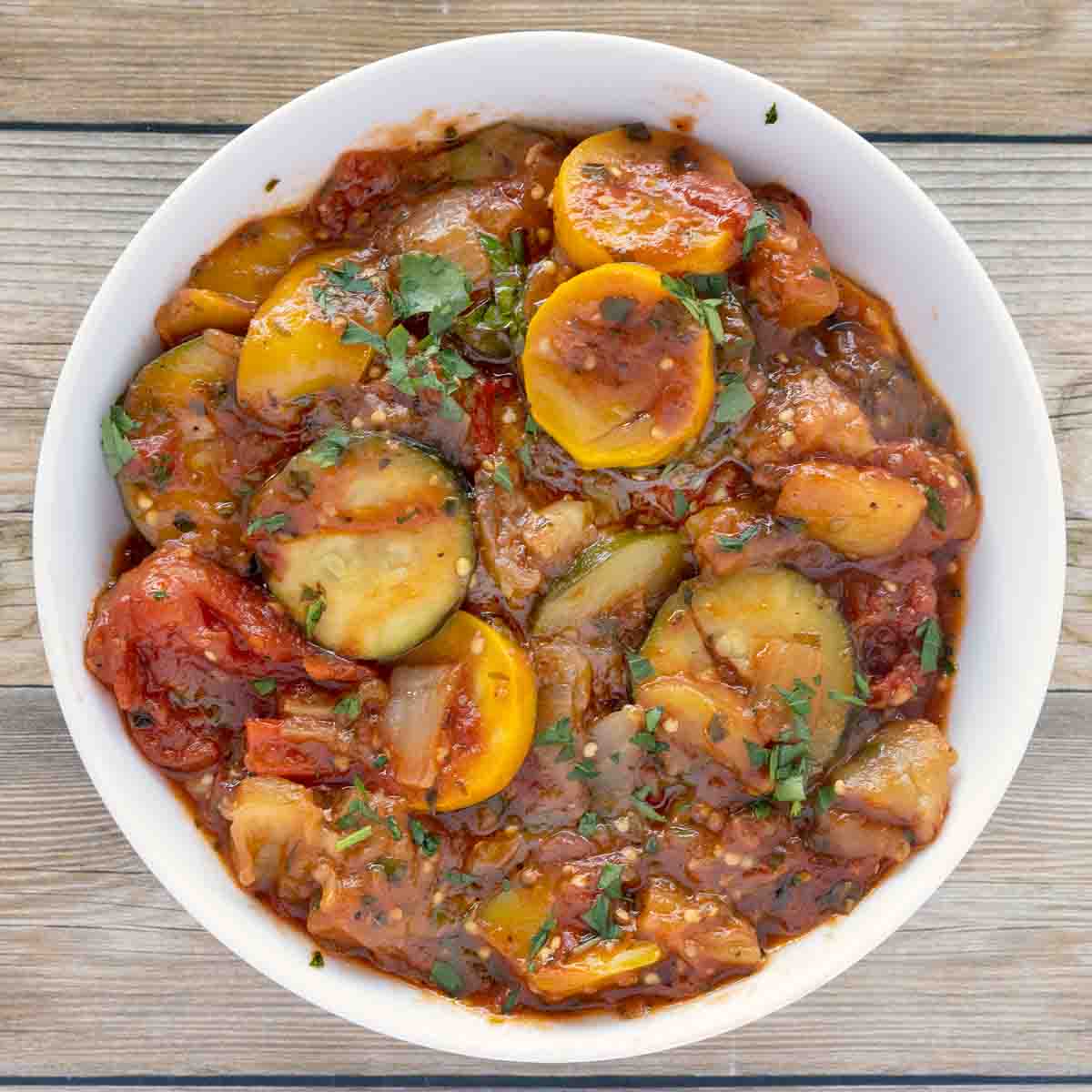 overhead view of ratatouille in a white bowl