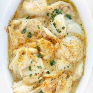 overhead view of baked seafood casserole in a white casserole dish