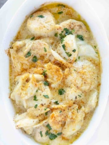 overhead view of baked seafood casserole in a white casserole dish