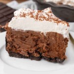 slice of french silk pie on a white plate.