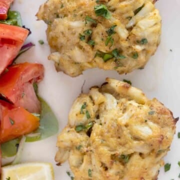 2 Maryland crab cakes on a white plate