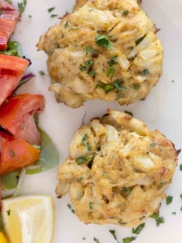 2 Maryland crab cakes on a white plate