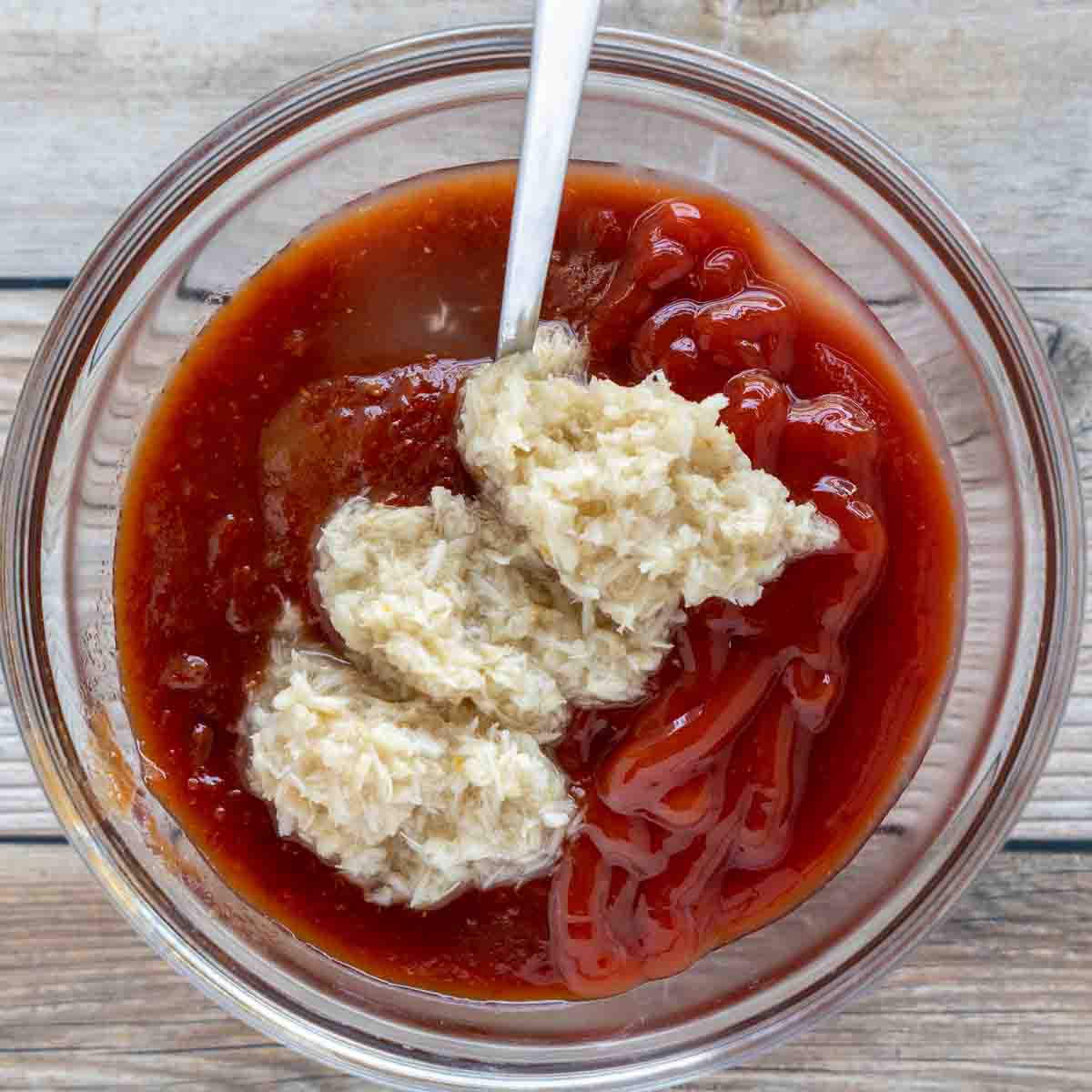 horseradish added to the bowl of ketchup an chili sauce