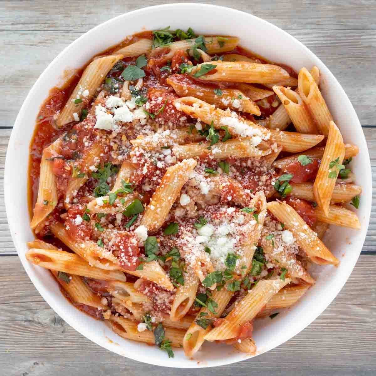 Arrabbiata sauce with penne in a white bowl