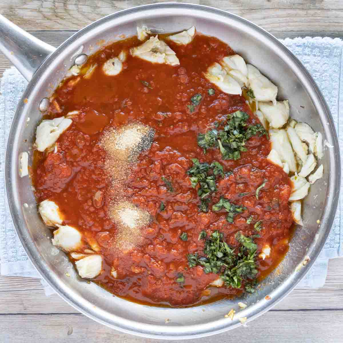 tomato sauce and seasonings added to saute pan.