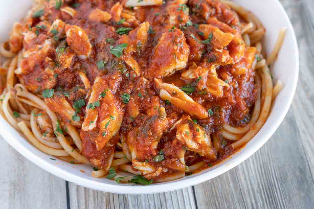 close up of pasta with red crab sauce