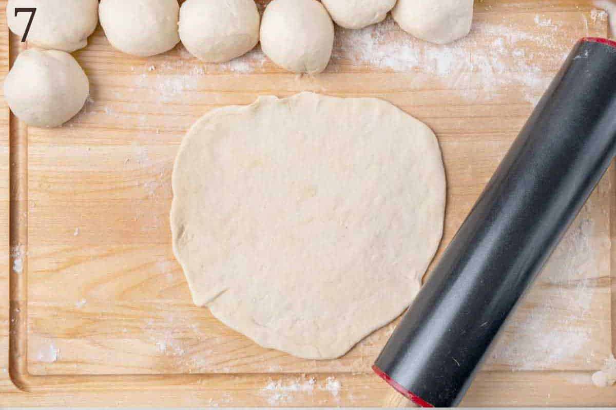 rolled out dough, with rolling pin.