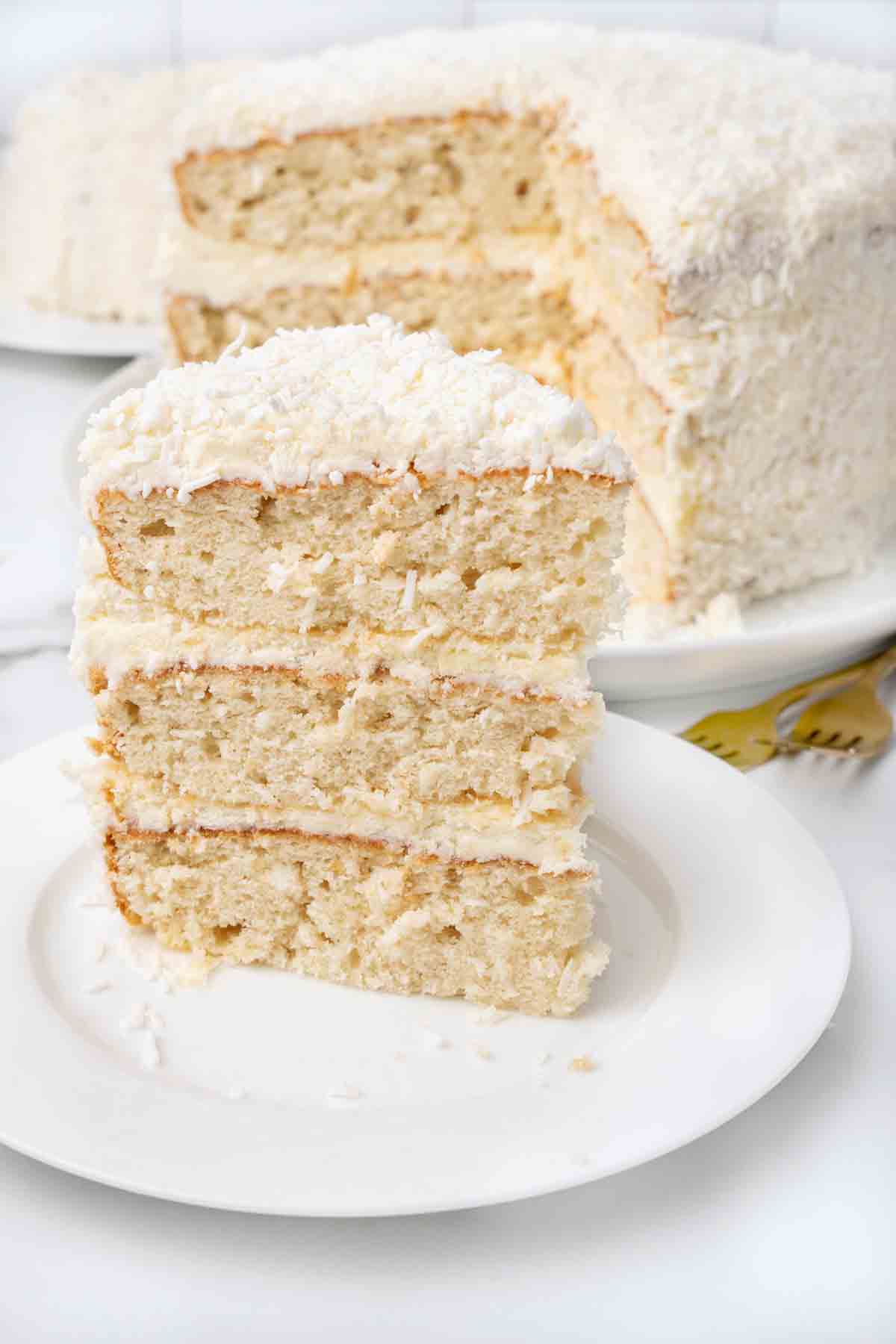 slice of coconut cake on white plate