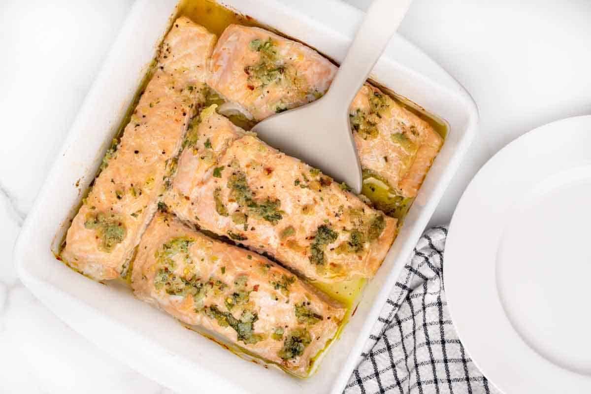 garlic butter salmon in a baking dish