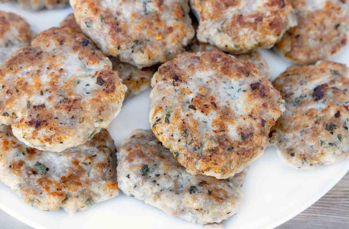 breakfast sausage patties on white plate