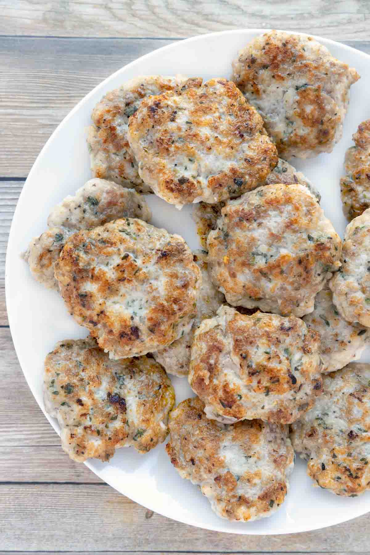 breakfast sausage patties on white plate