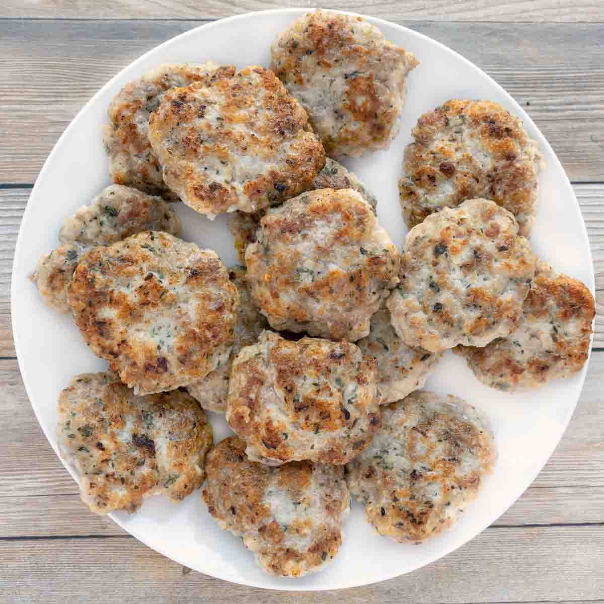 breakfast sausage patties on white plate