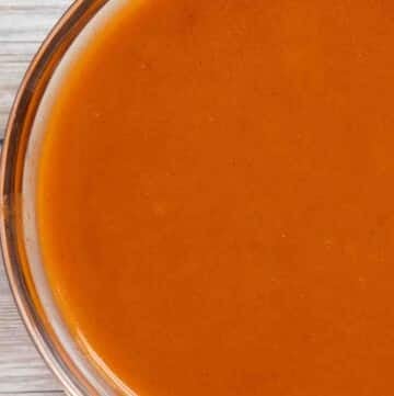 buffalo sauce in a glass bowl