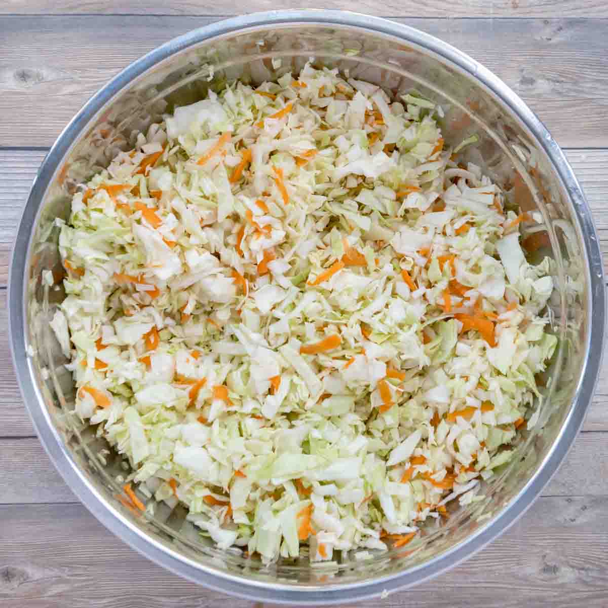 cabbage and carrots mixed in bowl.