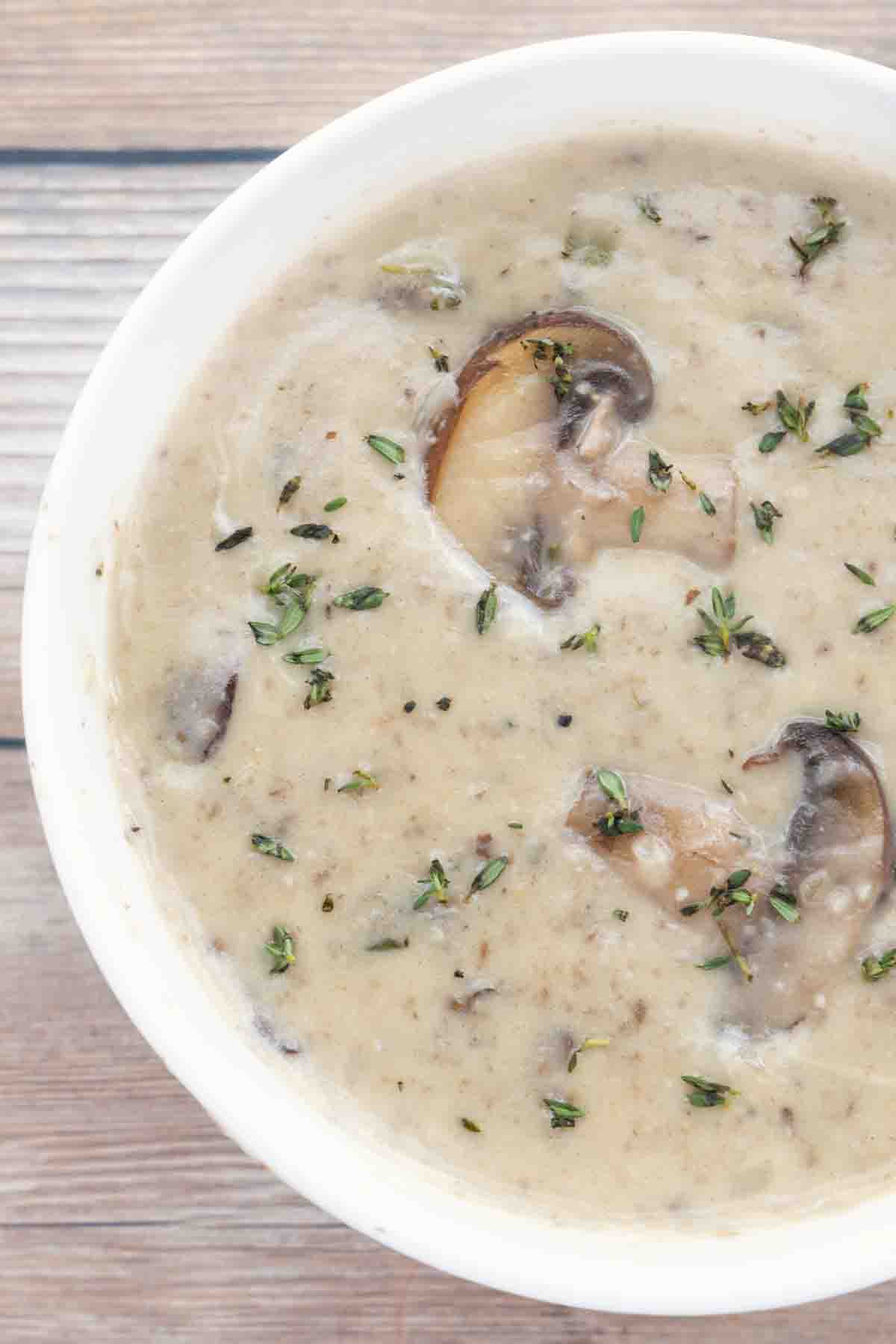 cream of mushroom soup in white bowl.