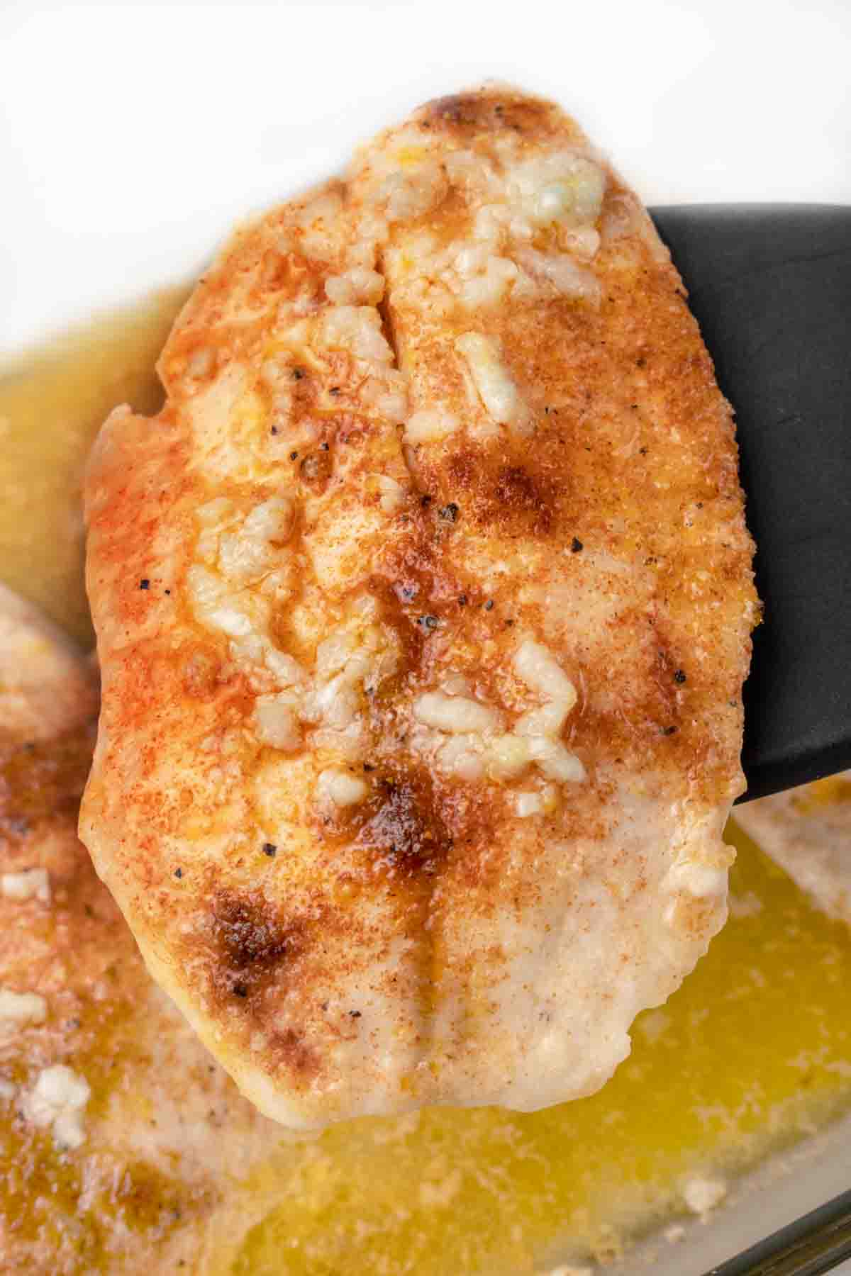 Garlic Butter Tilapia on black spatula