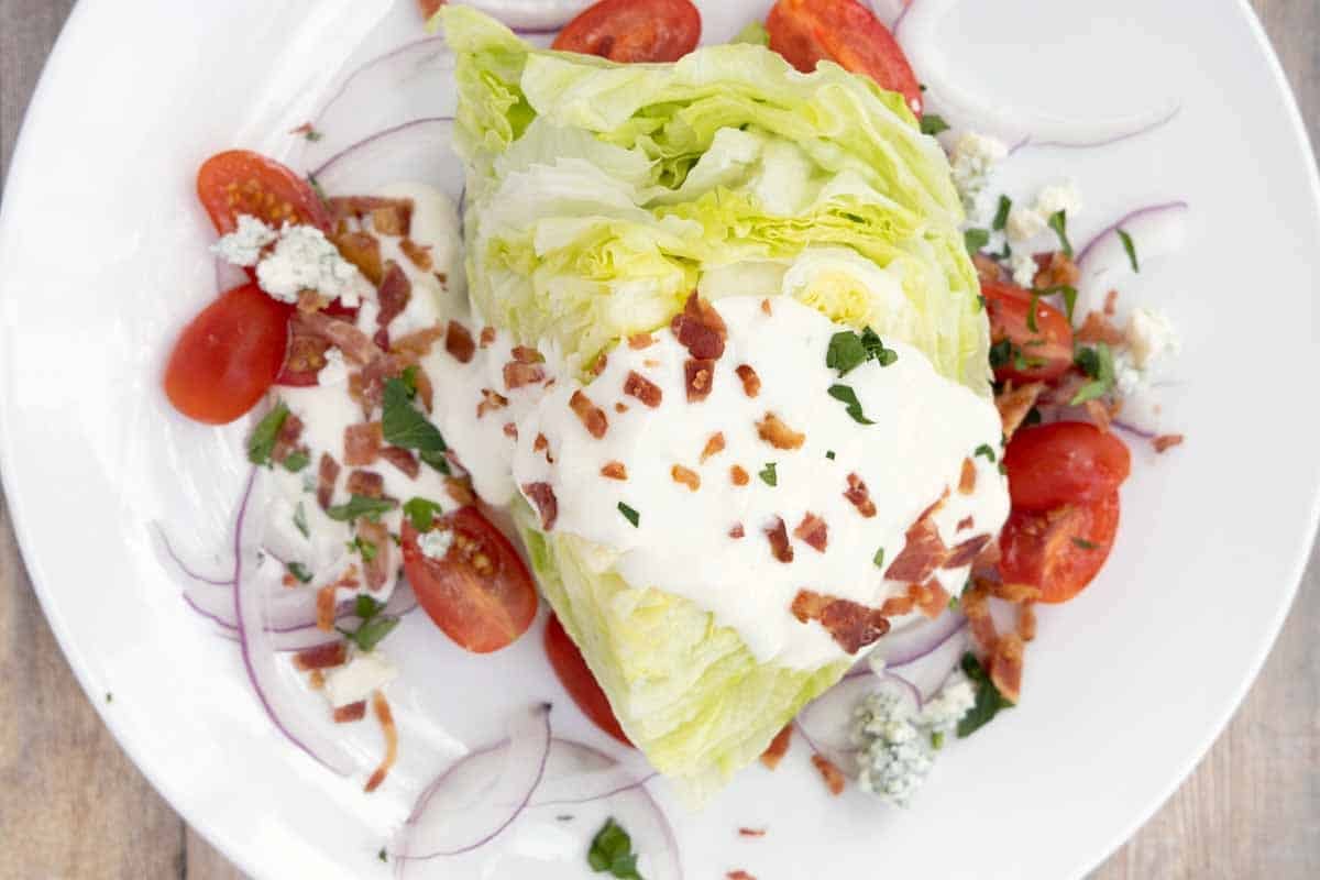 wedge salad on a white plate.