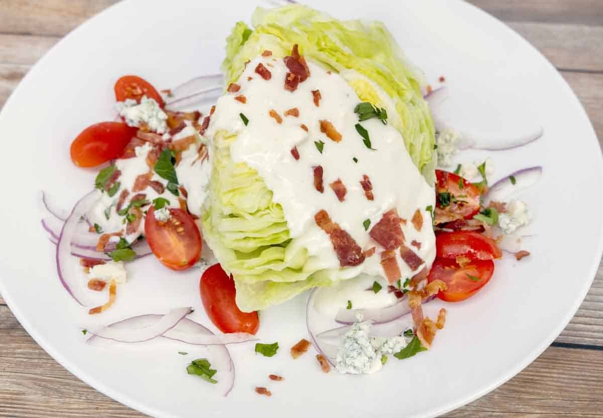 wedge salad on a white plate.