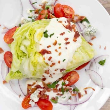 wedge salad on a white plate.