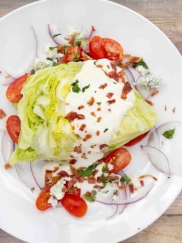 wedge salad on a white plate.