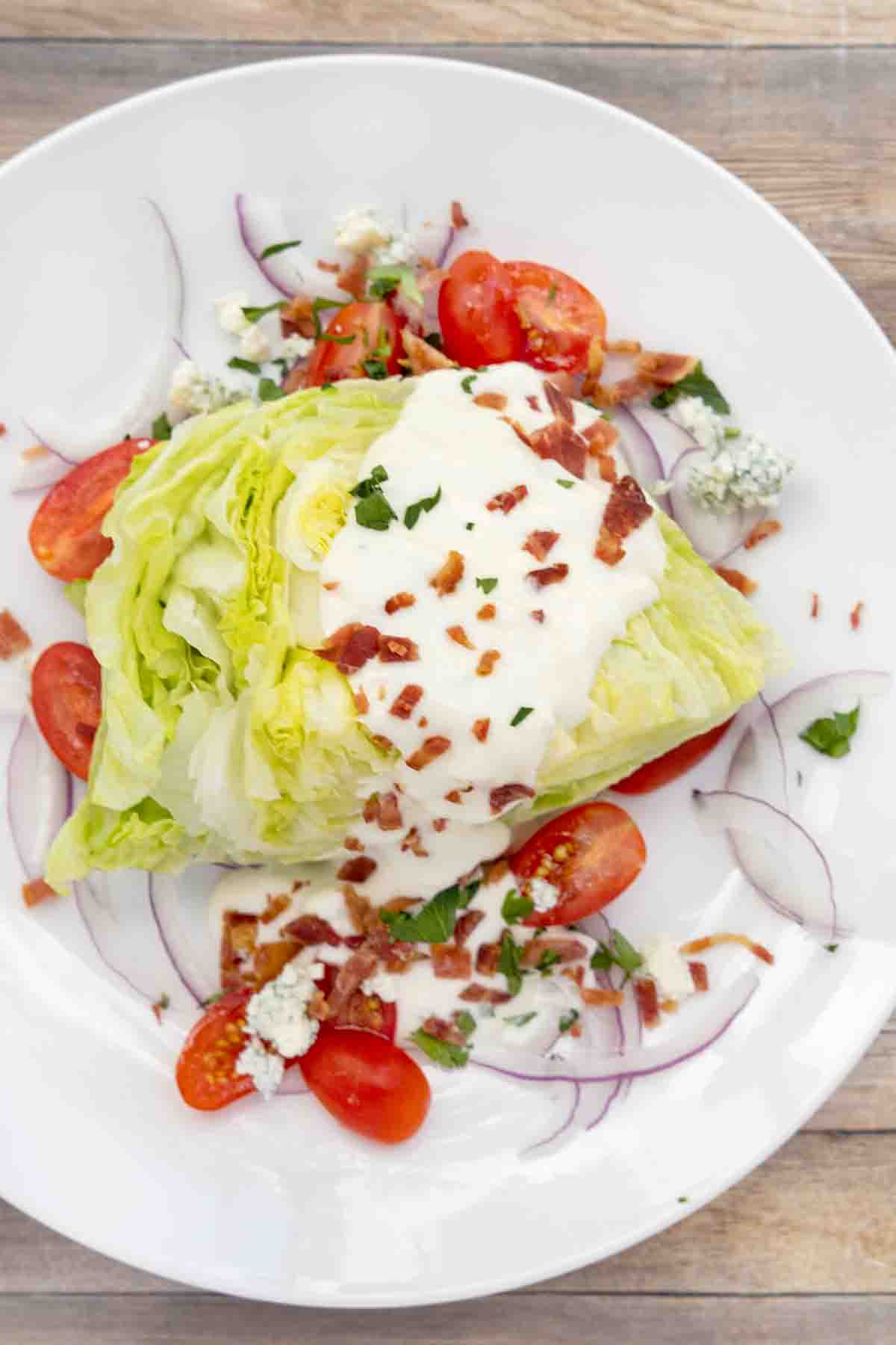 wedge salad on a white plate.