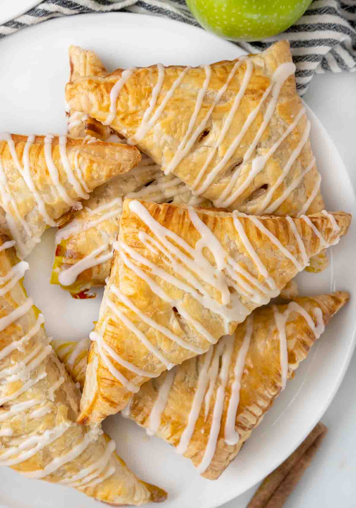 apple turnovers on white platter.