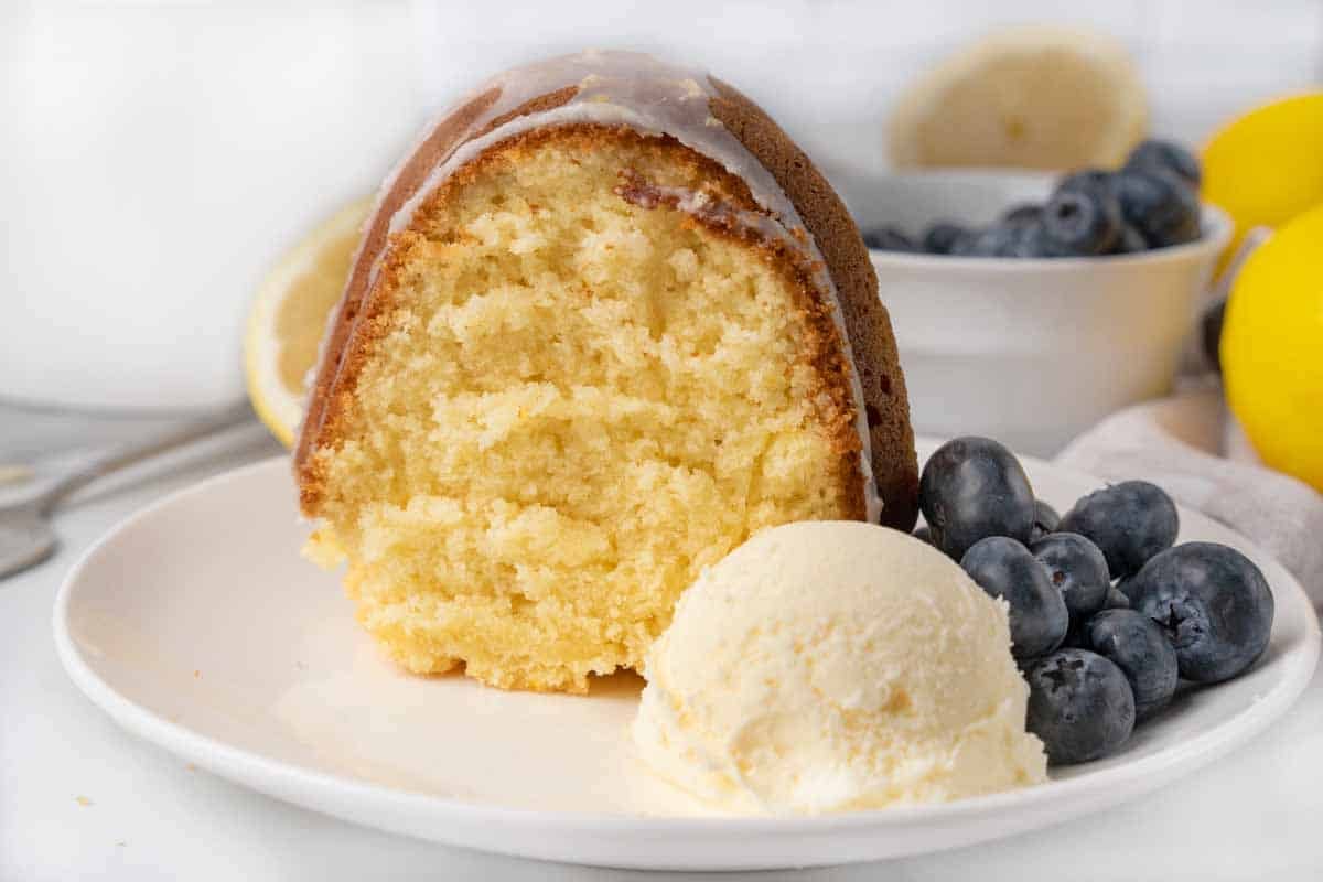 slice of lemon bundt cake with scoop of vanilla ice cream