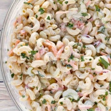 Macaroni salad in a glass bowl.