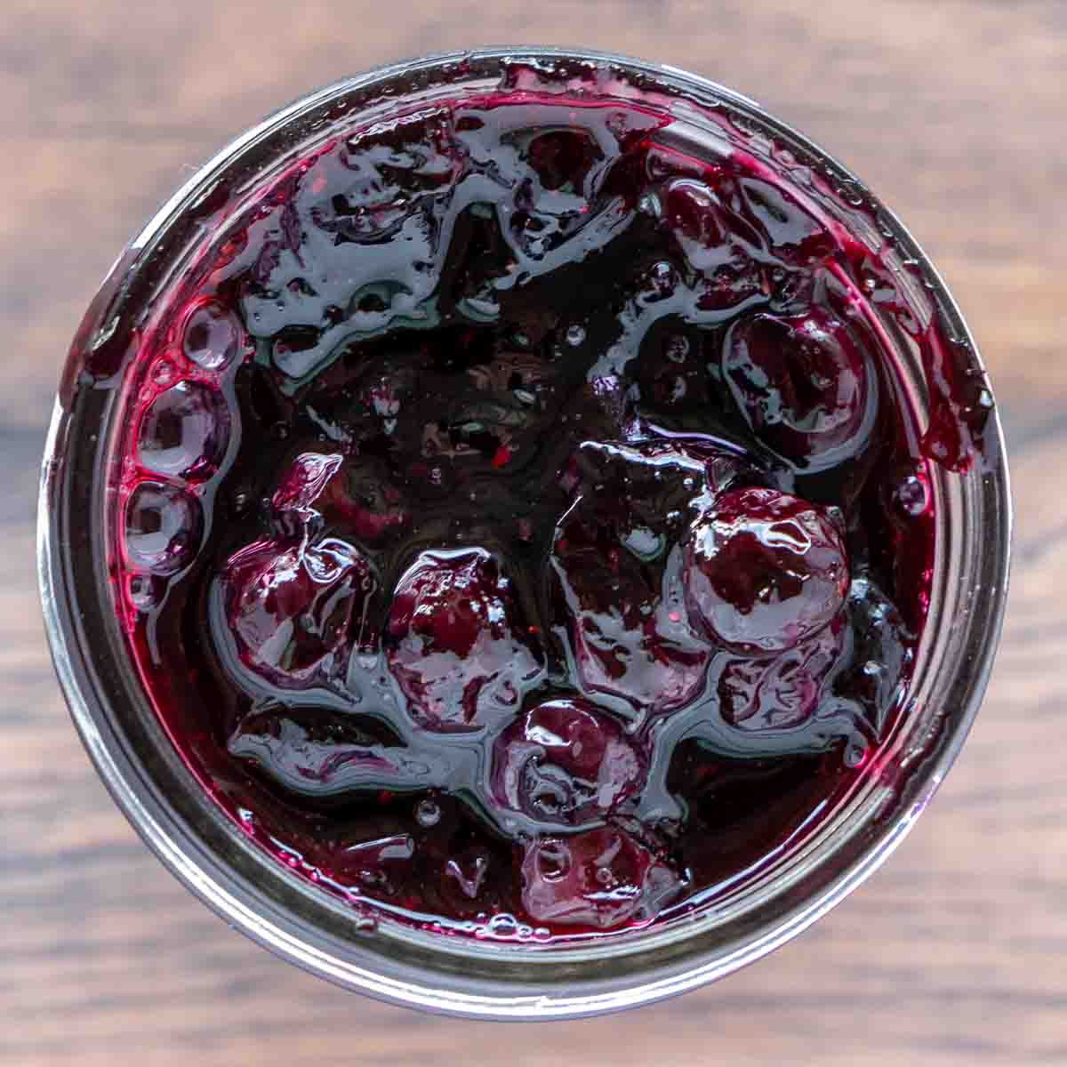 overhead look into jar of blueberry compote.