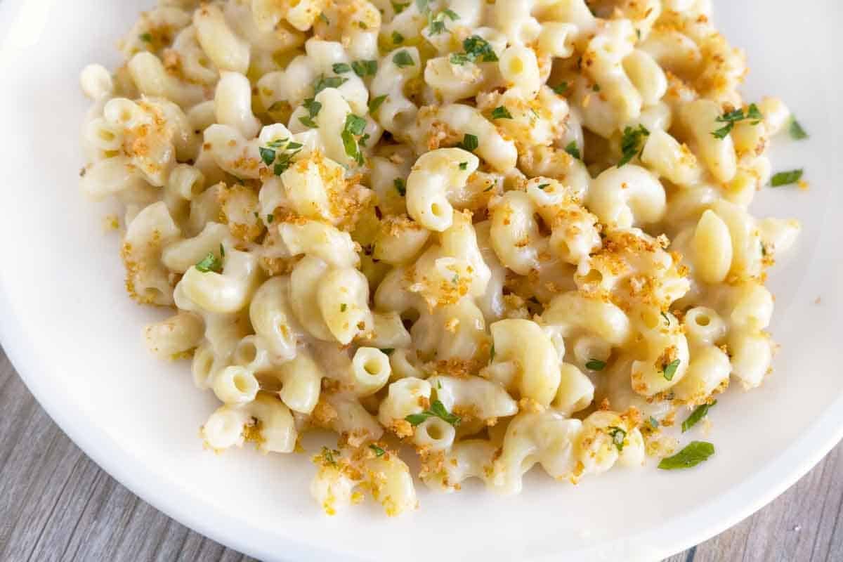 gouda mac and cheese on a white plate.