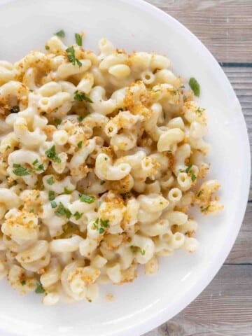 gouda mac and cheese on a white plate.