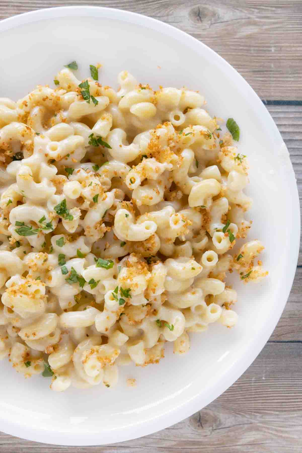 gouda mac and cheese on a white plate.