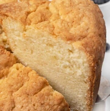 slice of sour cream pound cake taken out of whole cake.