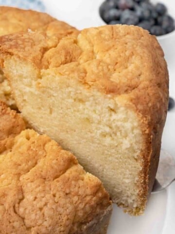 slice of sour cream pound cake taken out of whole cake.