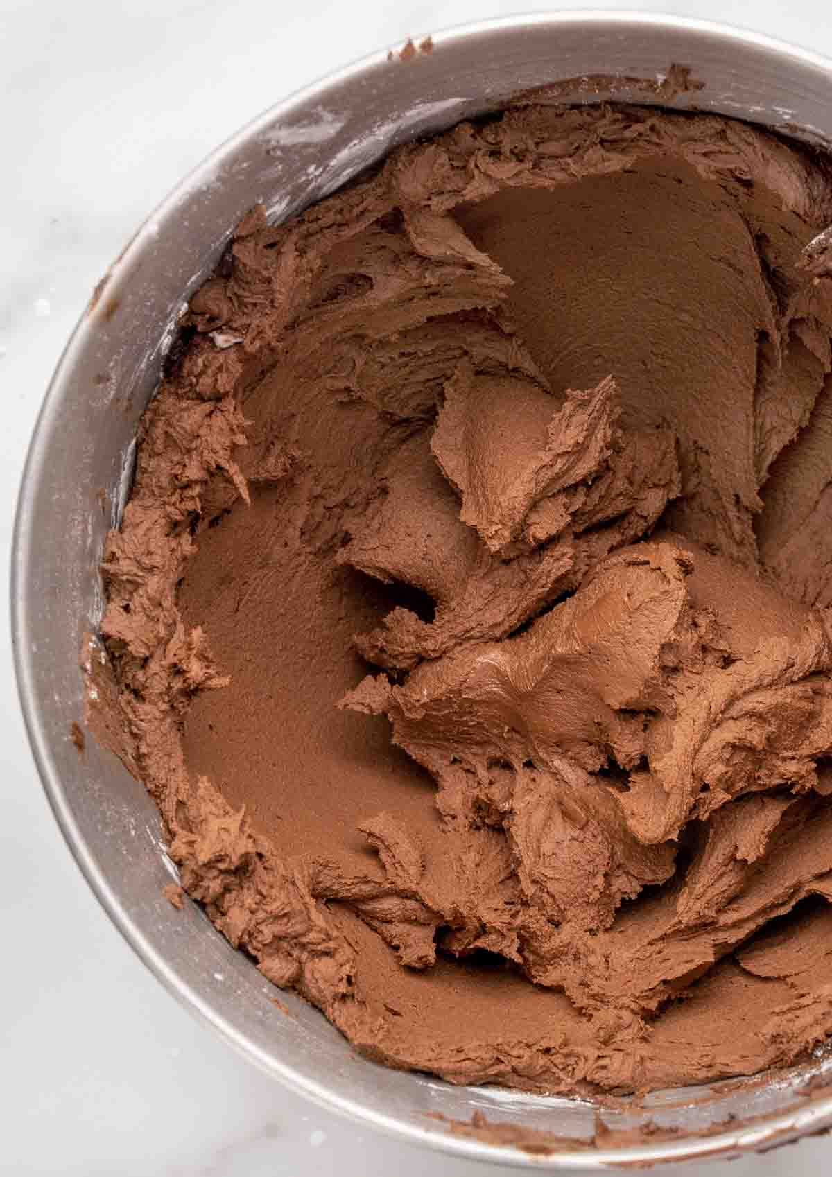 chocolate buttercream frosting in a mixing bowl.