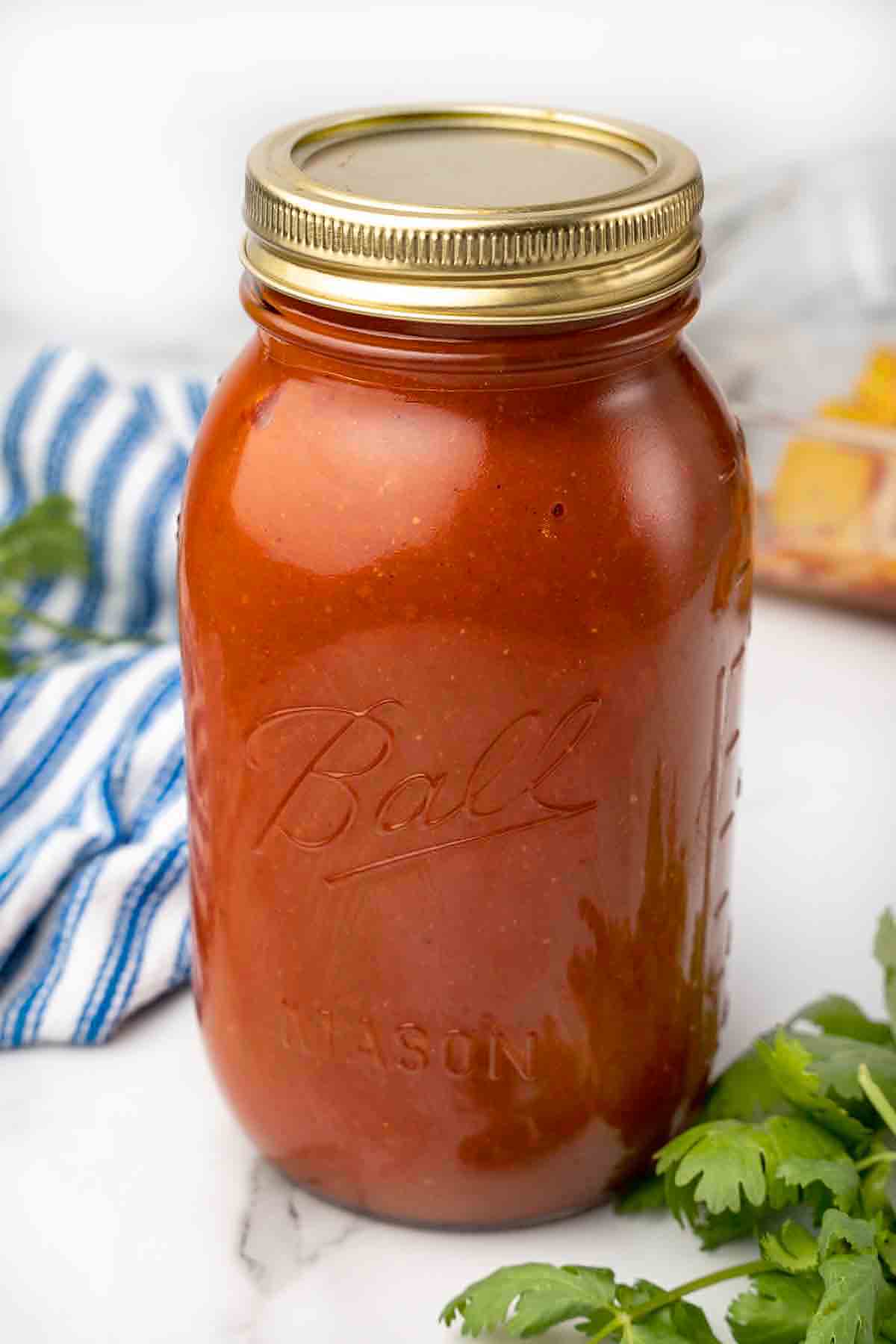 Ball jar of enchilada sauce.