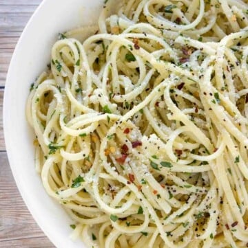 pasta with olive oil and garlic in a white bowl (pasta aglio e olio).