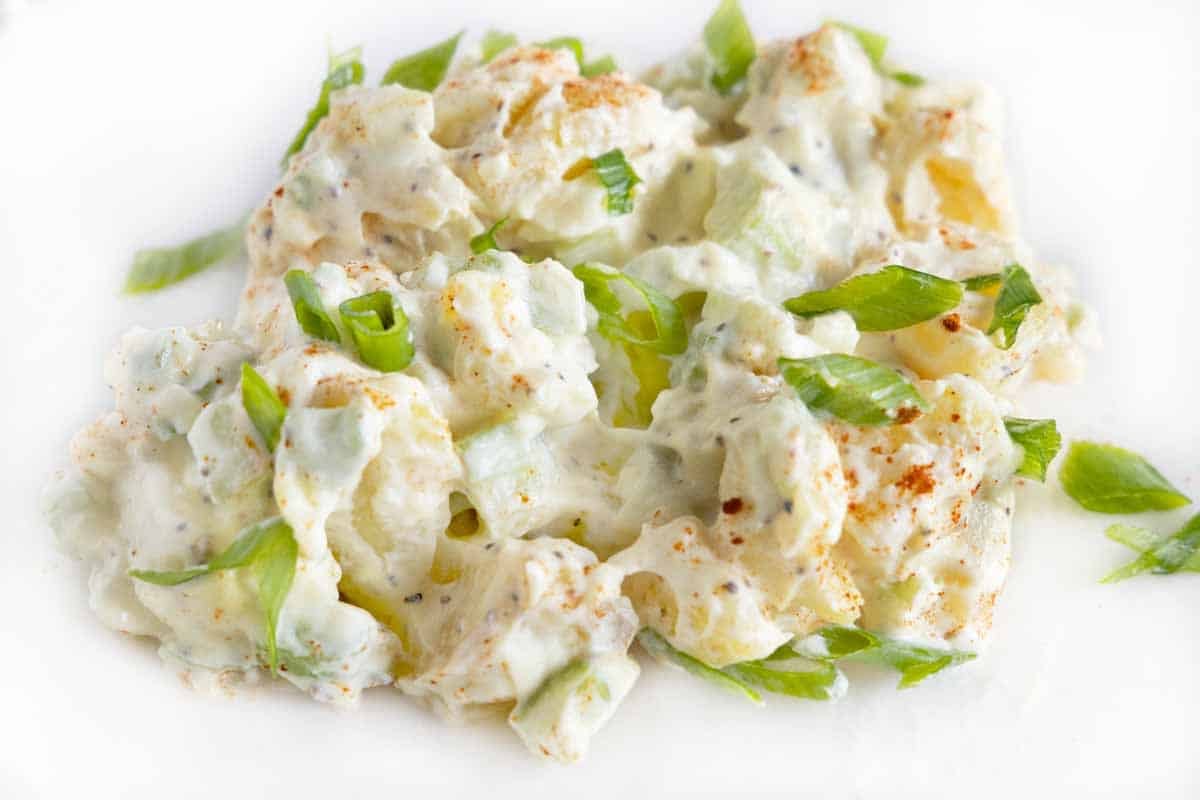 Potato salad on a white plate.