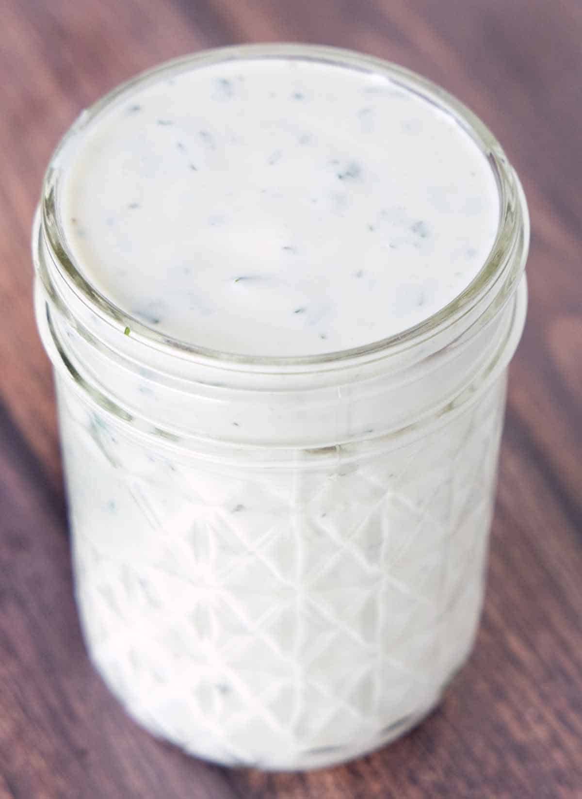 buttermilk ranch dressing in a glass jar.