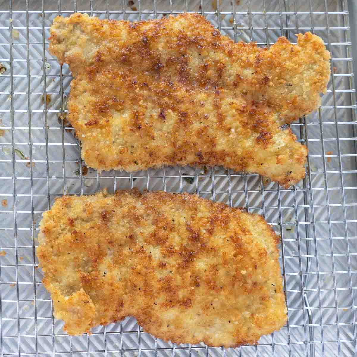 fried cutlets draining on wire rack.