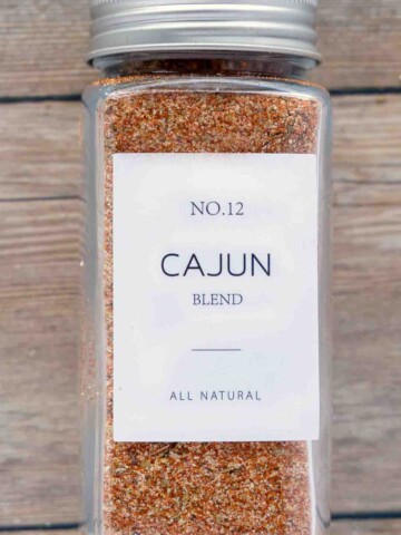 Cajun seasoning in a jar with white label,.