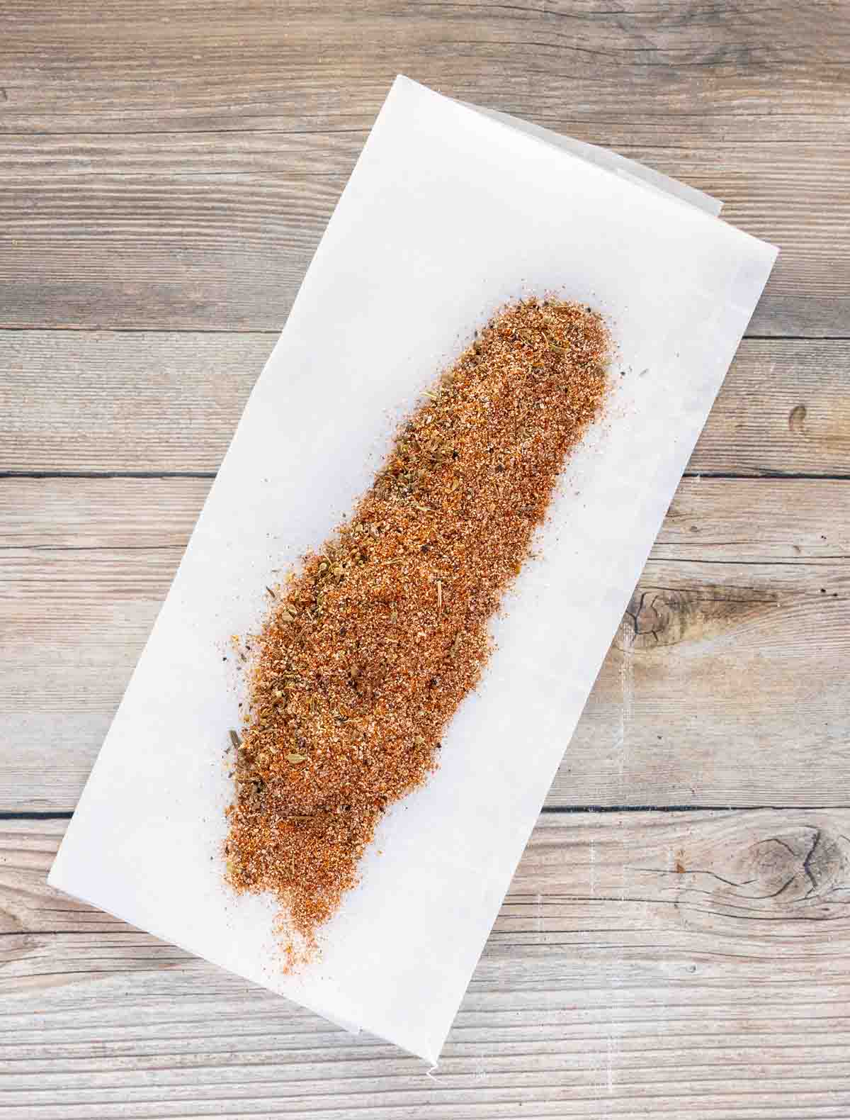 Homemade Cajun seasoning on white deli paper