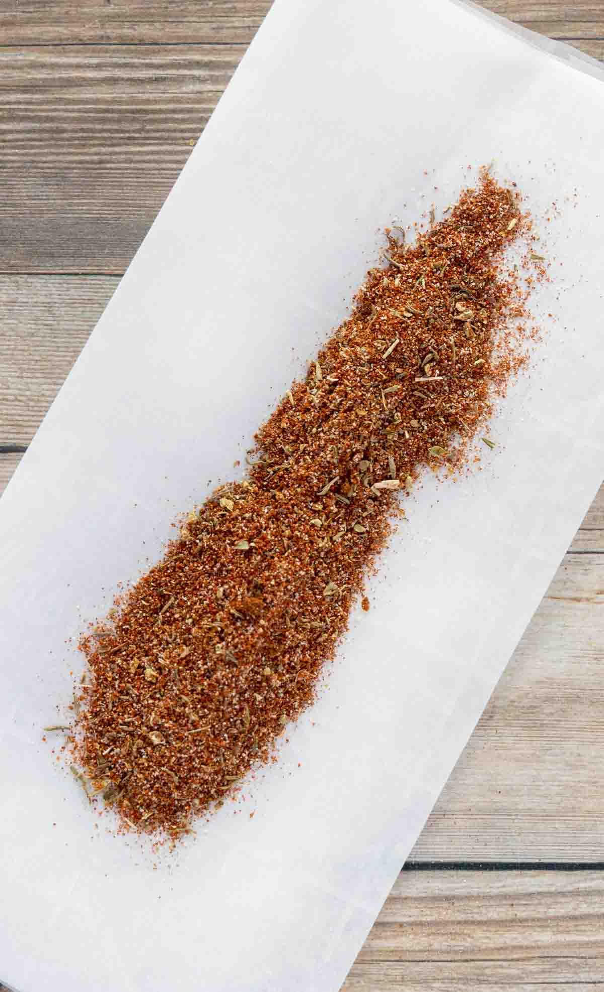 homemade chili seasoning on white deli paper.