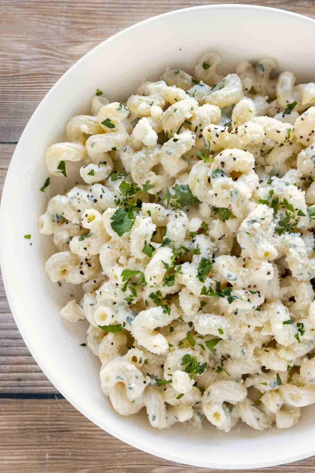 cream cheese pasta in a white bowl.