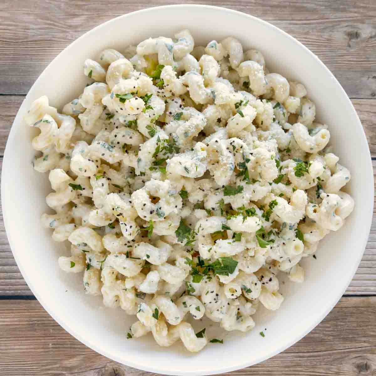 cream cheese pasta in a white bowl.